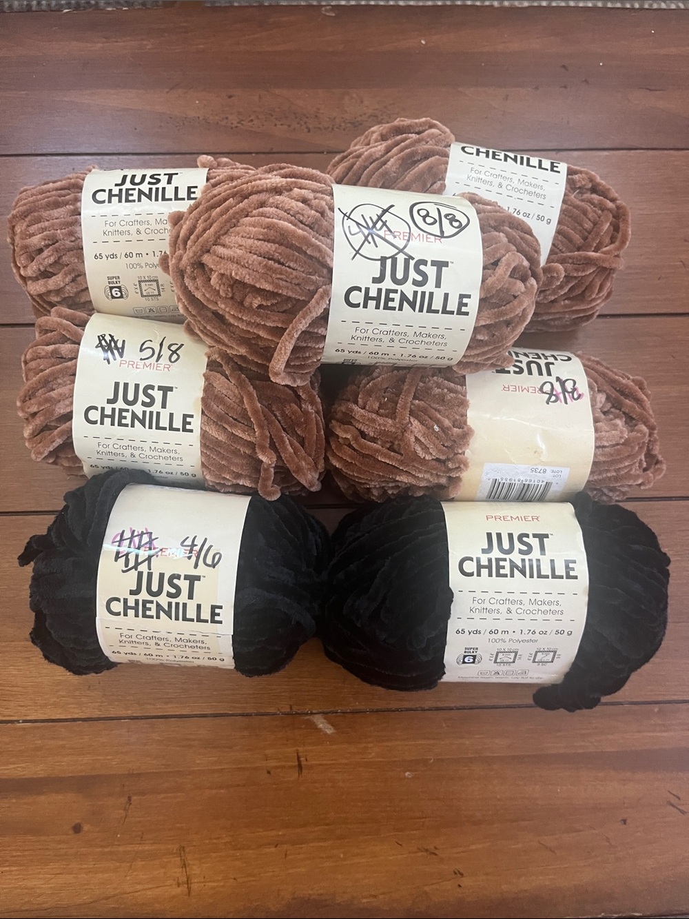 Premier Just Chenille Plush Yarn Bundle in Black (2) and Brown (5).